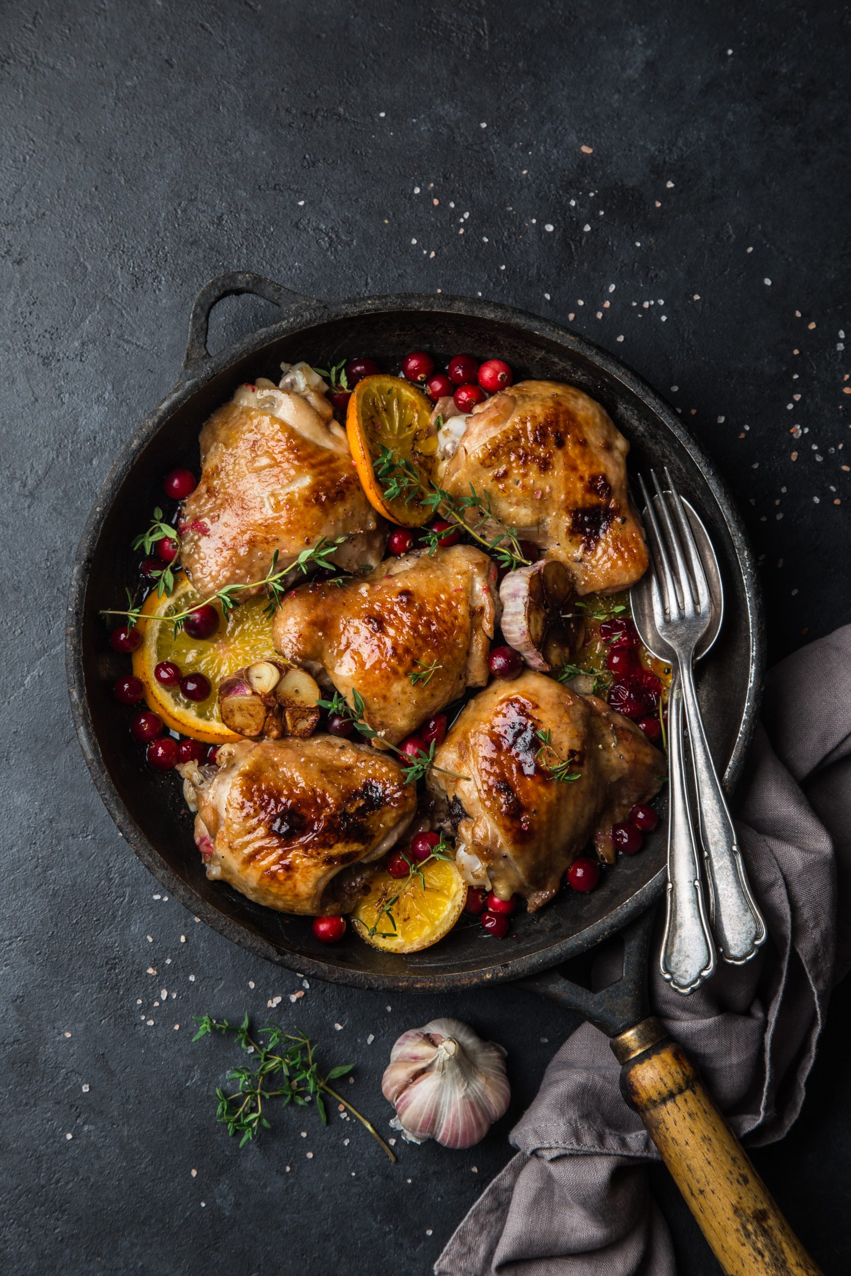 roasted  chicken with orange, cranberry and spicy herbs on pan